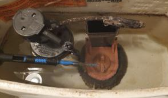 Eroded Components in toilet tank due to flapper